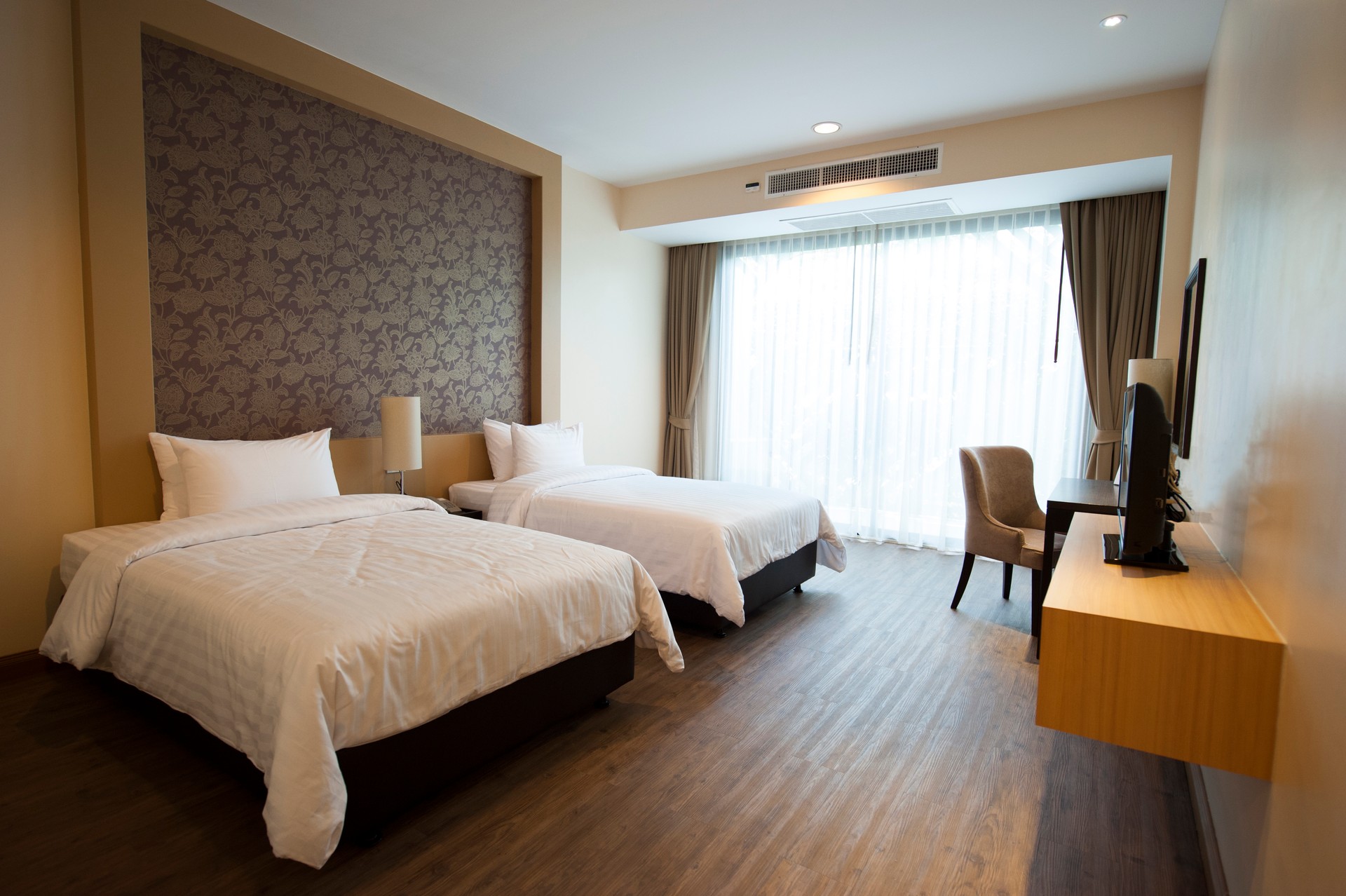 Luxurious two bed hotel room with hardwood floors